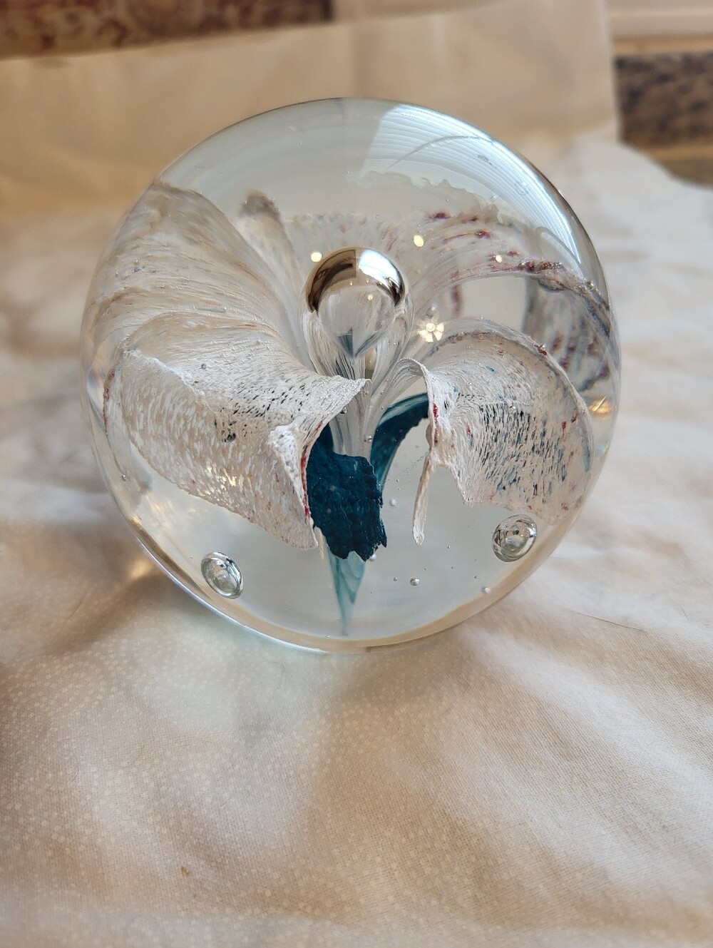 Handblown Glass Art 3 x 3 In. Sphere with White and Teal Floral Core Paperweight - Picture 3 of 10